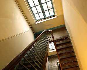 Image showing Looking down at an old wooden stairs at an abandoned building