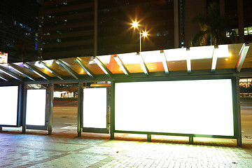 Image showing Blank billboard on bus stop at night