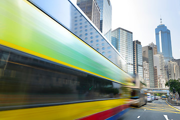 Image showing Bus speeding through the street