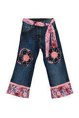 Image showing Blue children girl jeans with pink flowers pattern isolated on w
