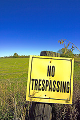 Image showing A 'NO TRESPASSING' sign fronts farmland in this autumn country landscape.(14MP camera)