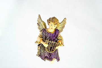 Image showing A Christmas ornament of an angel with harp, against a light blue 'sky' background. (14MP camera)