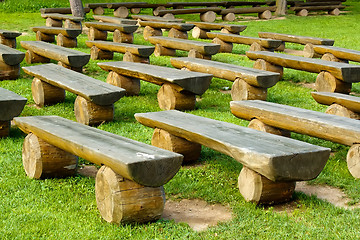 Image showing outdoor wood seating on green lawn