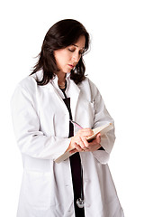 Image showing Female doctor writing prescription notes
