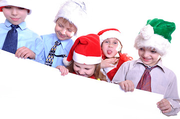 Image showing Christmas children with a banner