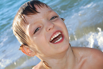 Image showing happy boy in waves