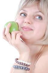 Image showing beautiful blond woman with an apple