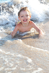 Image showing happy boy in waves