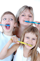 Image showing family cleaning teeth