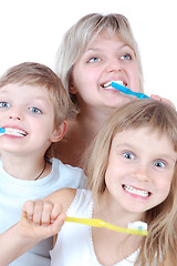 Image showing children and mother cleaning teeth