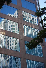 Image showing Office building reflecting in another building window