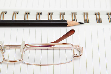 Image showing A diary with a pencil and glasses