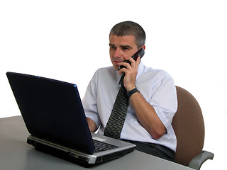 Image showing Man speaking to the phone at the office desk