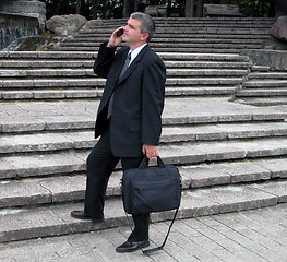 Image showing Businessman in a park