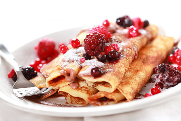 Image showing Crepes filled with chocolate and berries