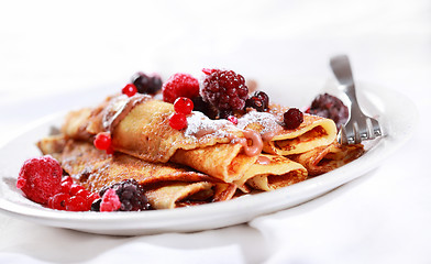 Image showing Crepes filled with chocolate and berries