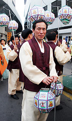 Image showing Carrying lanterns