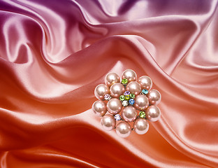 Image showing Brooch closeup on silk background