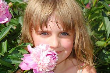 Image showing child and flower