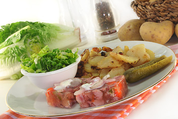 Image showing Fried potatoes with meat jelly