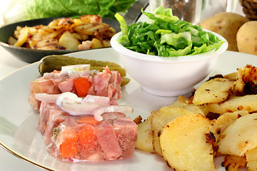 Image showing Fried potatoes with meat jelly