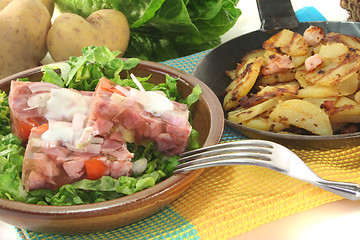 Image showing Fried potatoes with jelly