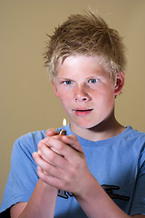 Image showing Boy with lighter