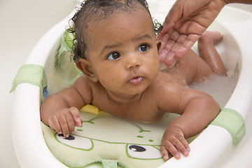 Image showing Baby girl taking a bath