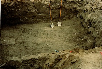 Image showing hole with shovels