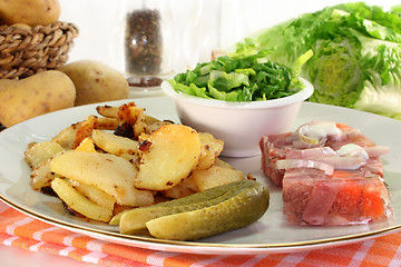 Image showing Fried potatoes with meat jelly