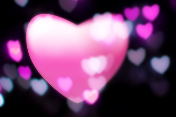 Image showing Pink heart blurs into out-of-focus heart-light background