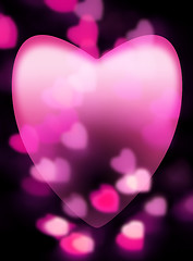 Image showing Pink heart fades into dark background with out-of-focus heart-sh