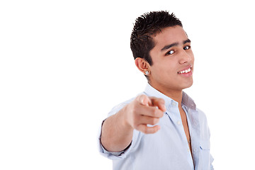 Image showing young and happy latin man pointing