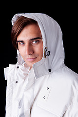 Image showing Portrait of a young man  wearing a white coat with hood