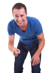 Image showing Portrait of a handsome middle-age man, pointing and laughing, very happy