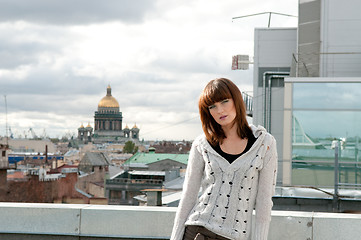 Image showing Girl  over city background 
