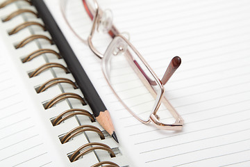 Image showing A diary and reading glasses