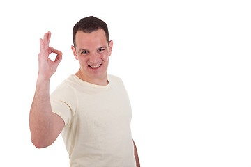 Image showing handsome man with arm raised in ok sign