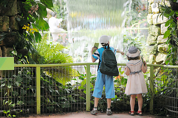 Image showing Children at the entrance to the country of flowers