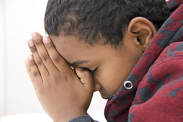 Image showing A Young kid praying