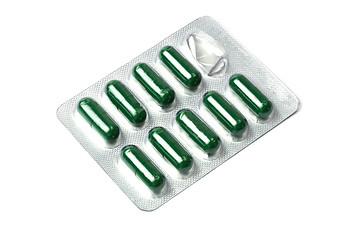 Image showing Green capsules packed in blister