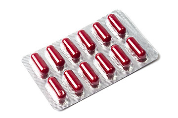 Image showing Red capsules packed in blister