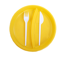 Image showing Yellow plastic plate, fork and knife