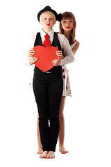 Image showing Two girls with red cardboard heart