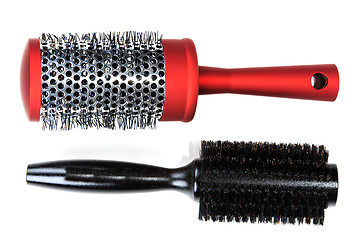 Image showing Two red massages comb