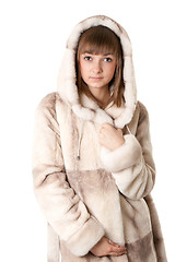 Image showing A beautiful young girl in a fur coat