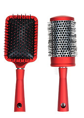 Image showing Two red massages comb