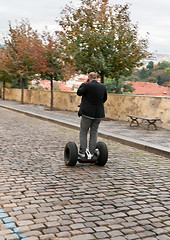 Image showing A man rides on electric bike