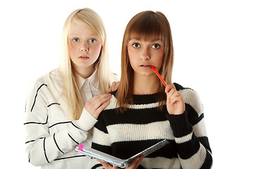 Image showing Two beautiful girls read diary book