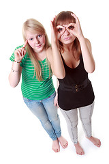 Image showing Two girls stand and make faces